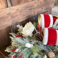holiday table centerpiece with frosted greenery