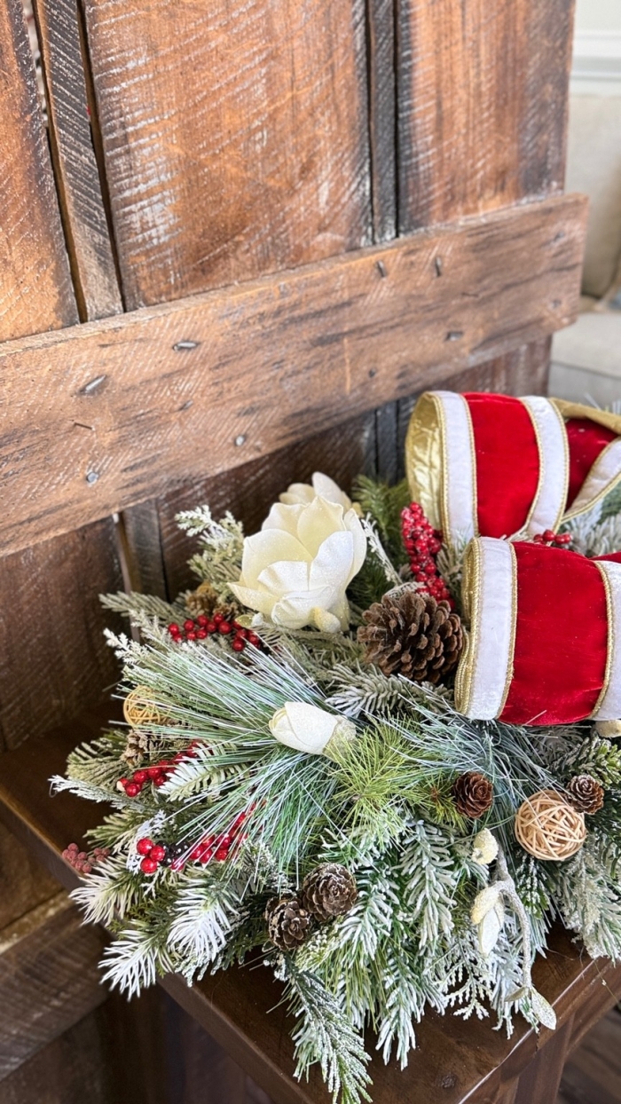 holiday table centerpiece with frosted greenery