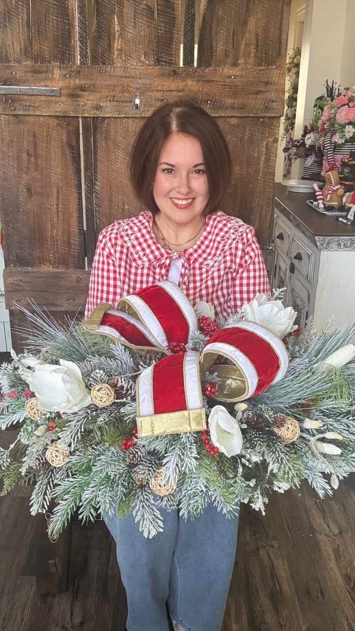 christmas evergreen centerpiece with red and white velvet bow
