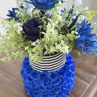Back side of bold blue floral arrangement
