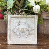 close up of neutral drawer container with floral arrangement