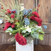 handmade red blue white centerpiece with wispy greenery