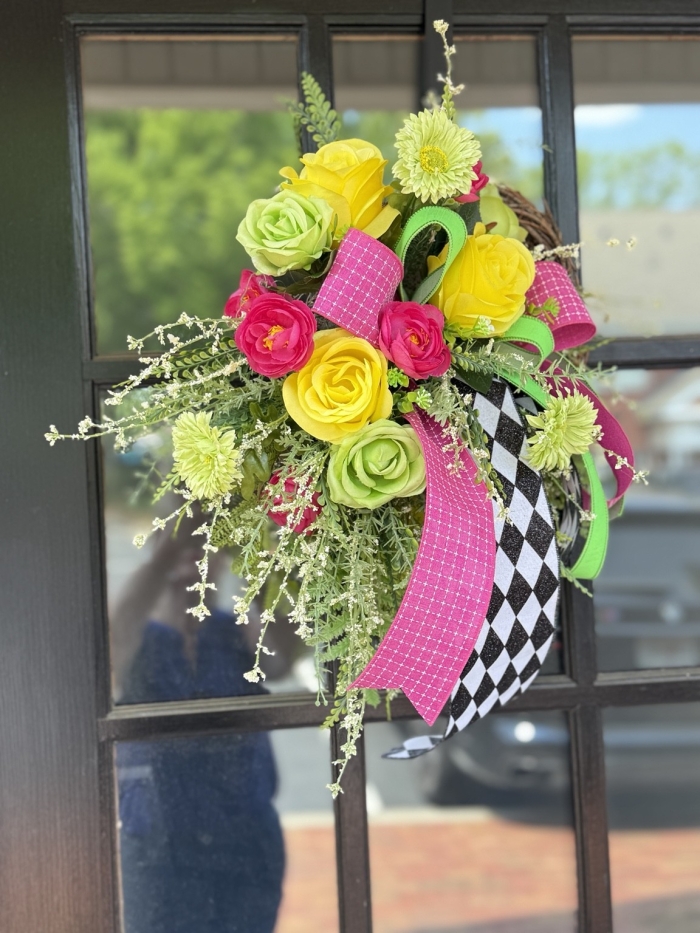 Bright pink and lime green harlequin mini wreath with yellow roses and greenery