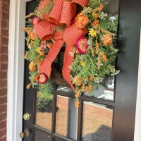 Side angle showing depth, dimension, and fullness of wreath.